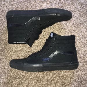 All black mid-rise Vans